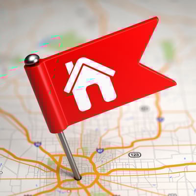 Red Small Flag with House Icon on a Map Background with Selective Focus. Red Small Flag with House Icon on a Map Background with Selective Focus.