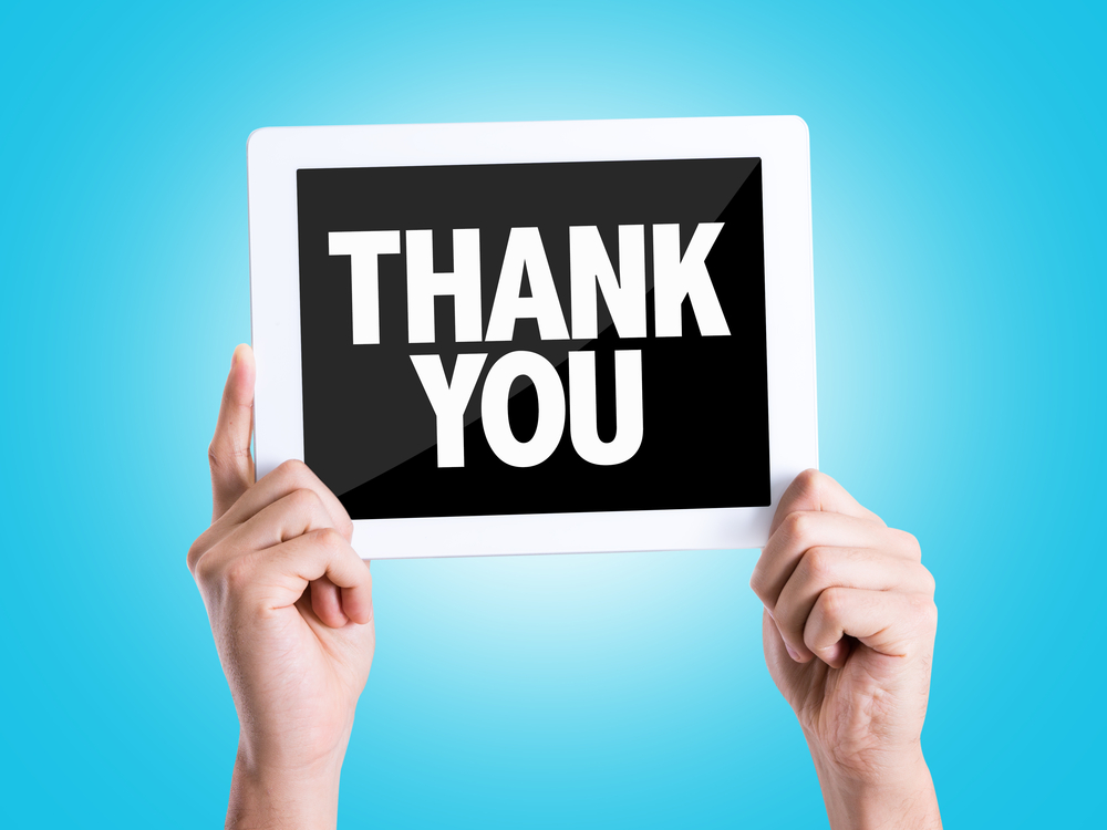 Tablet pc with text Thank You with blue background Tablet pc with text Thank You with blue background